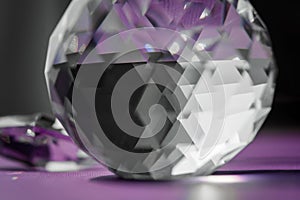 Crystal prism refracting light, magic crystals and pyramid, sphere and cube on purple background. Spiritual healing