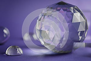 Crystal prism refracting light, magic crystals and pyramid, sphere and cube on purple background. Spiritual healing