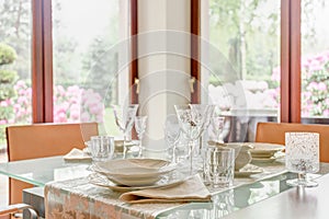 Crystal stemware and porcelain tableware photo