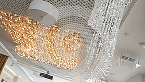 Crystal strass lamp over warm light background luxury interior design