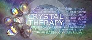 Crystal therapy word cloud on rustic rainbow background