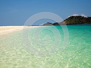 Crystal turquoise green sea ocean clear water and mountain at Lipe Island, Satun, Thailand