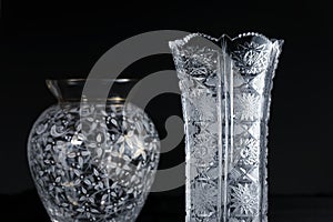 Crystal vase with a modern one on black background