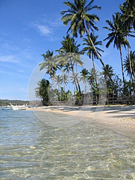 crystal waters blue sky white beach philippines