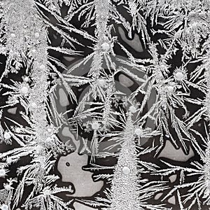 Crystalline frost pattern on window glass closeup