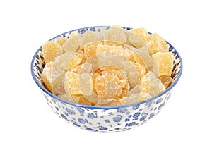 Crystallised stem ginger in a blue and white china bowl photo