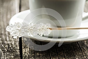 Crystallized sugar on wooden stick.