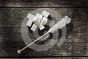 Crystallized sugar on wooden stick.