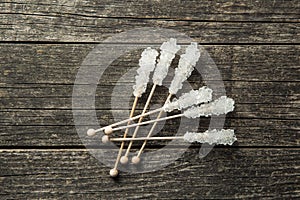 Crystallized sugar on wooden stick.