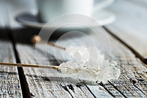 Crystallized sugar on wooden stick.