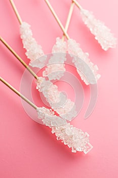 Crystallized sugar on wooden stick.