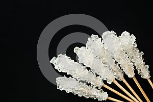 Crystallized sugar on wooden stick.