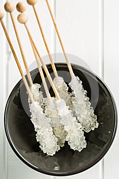 Crystallized sugar on wooden stick.