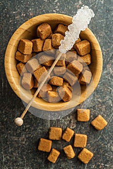 Crystallized sugar on wooden stick.