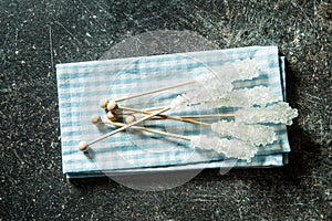 Crystallized sugar on wooden stick.