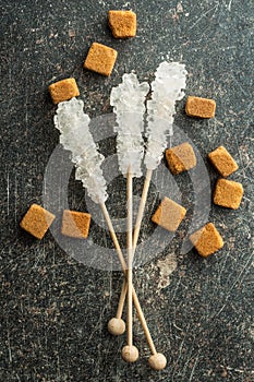 Crystallized sugar on wooden stick.