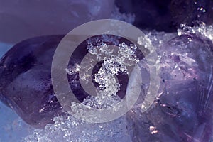 Crystals of amethyst in the snow.