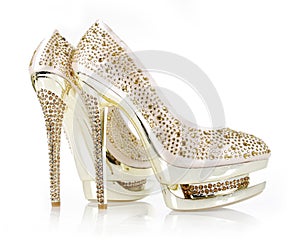 Crystals encrusted gold pair of shoes photo