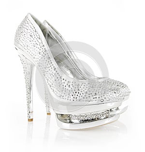 Crystals encrusted silver pair of shoes photo