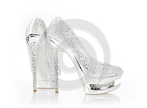 Crystals encrusted silver pair of shoes photo