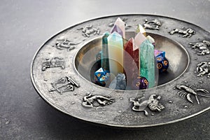 Crystals for healing, fortune telling and astrologhy circle on grey background. Esoteric and life coaching concept.
