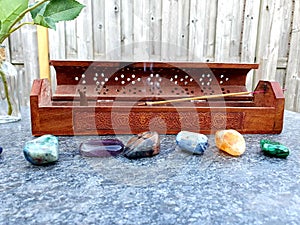 Crystals next to Incense Burner : CHAKR ASTONES  Polished Raw Lake Stones Gems River Water Rocks