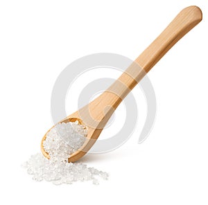 Crystals of salt in a wooden spoon with long handle isolated on white background
