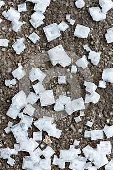 Crystals of self-precipitating common salt (sodium chloride) crystallized at the bottom