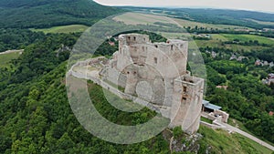 Csesznek, Hungary - 4K drone descending by the ruins of the Castle of Csesznek lies in the Bakony in the village of Csesznek