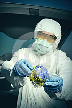 CSI - technician sealing evidence of special micro particles vacuum filter