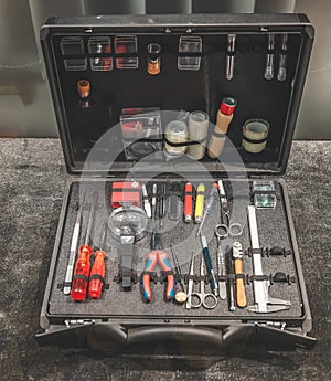 CSI toolkit, crime scene investigation suitcase filled with different tools for criminology