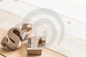 CSR Corporate social responsibility abbreviation wood letters on natural white wooden background for business vision concept