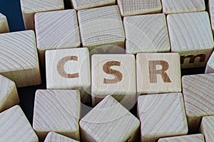 CSR, Corporate social responsibility, corporate sustainability, sustainable business, corporate conscience concept, cube wooden