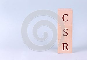 CSR on wooden cubes on a blue background