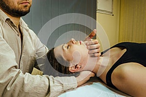 a CST treatment session for a woman, Osteopathic Manipulation and CranioSacral Therapy