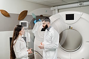 CT scan doctors are discussing x-ray of computed tomography of brains of patient. Computed tomography doctors are