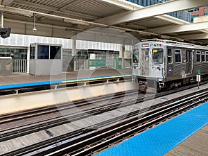 CTA el train entering the train station at the Merchandise Mart in Chicago Loop