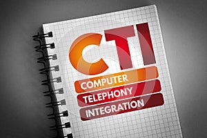 CTI - Computer Telephony Integration acronym on notepad, technology concept background