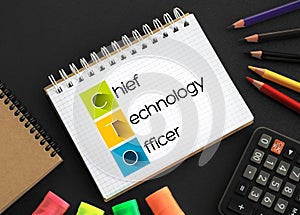 CTO - Chief Technology Officer acronym on notepad, business concept background photo