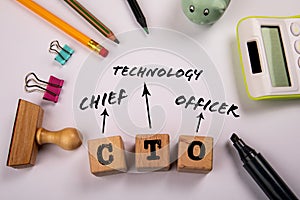 CTO - Chief Technology Officer. Wooden blocks on a white office table