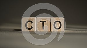 CTO word chief technology officer written in cubes on a black background