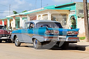 Cuba american blue vintage car parked on the road