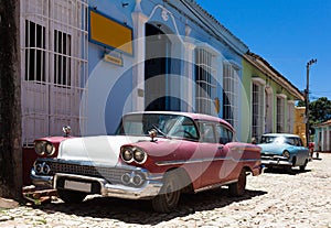 Cuba a american classic cars parked on the street