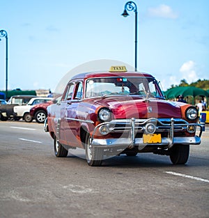 Cuba american Oldtimer taxi on the main road in Havana