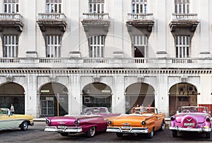 Cuba classic cars parked in series in Havana