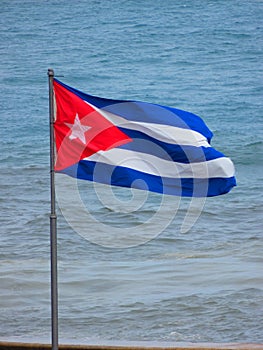 Cuba, Havana, Flag. Simbol of the nation in front of the sea.