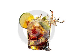 Cuba Libre with brown rum, cola, mint and lime. Cold Longdrink, alcohol cocktail. Place for text, dark background.