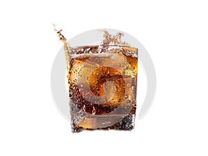 Cuba Libre with brown rum, cola, mint and lime. Cold Longdrink, alcohol cocktail. Place for text, dark background.
