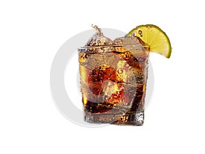 Cuba Libre with brown rum, cola, mint and lime. Cold Longdrink, alcohol cocktail. Place for text, dark background.