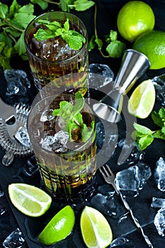 Cuba libre cocktail with rum, cola and lime, holidays party concept